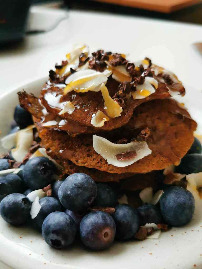 A plate of pancakes and berries