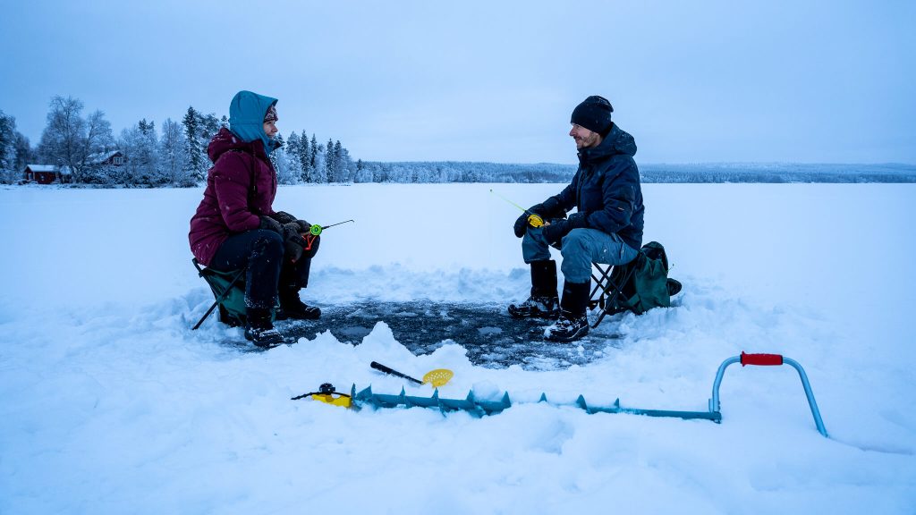 Ice fishing in Lapland, Finland