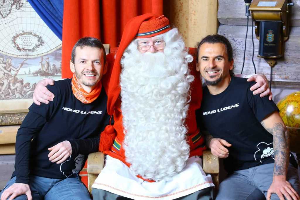 Photo of two friends visiting Santa Claus